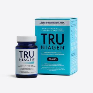 A bottle of Tru Niagen supplement with 300mg dosage, featuring a blue label and white cap. It also shows the blue carton packaging the bottle comes in.